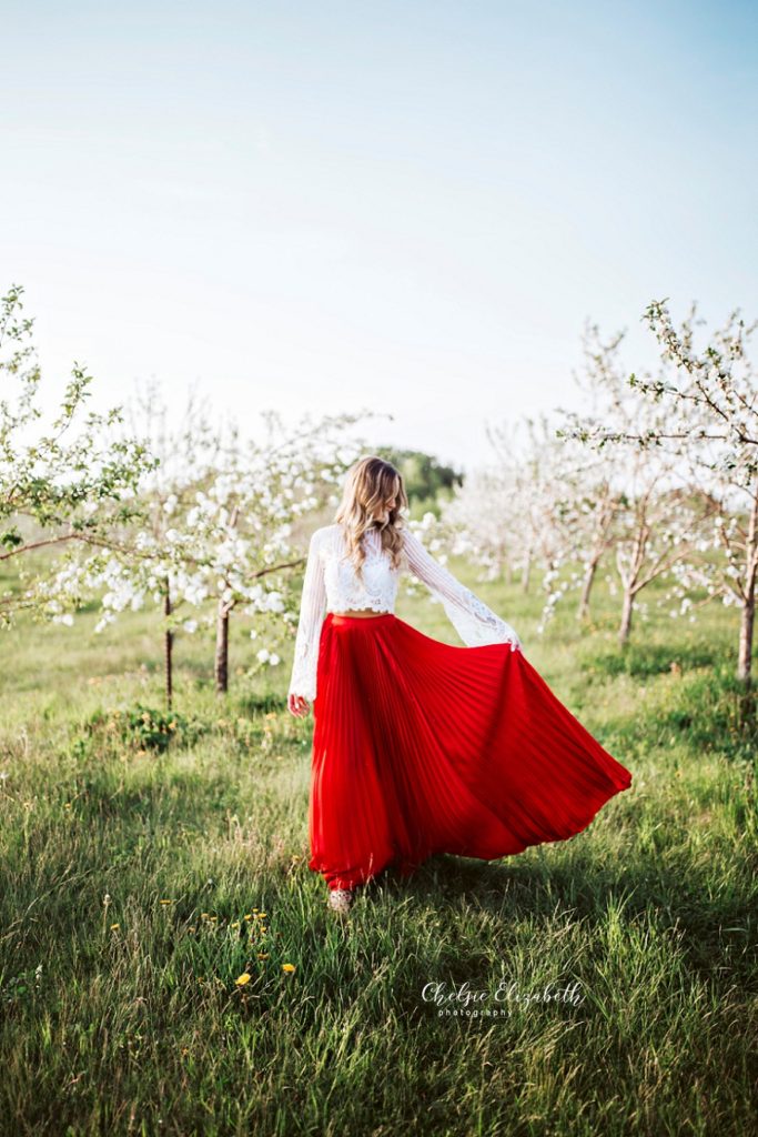 Portrait of woman in long red skirt