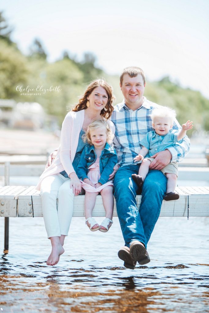 family of 4 on dock at gull lake