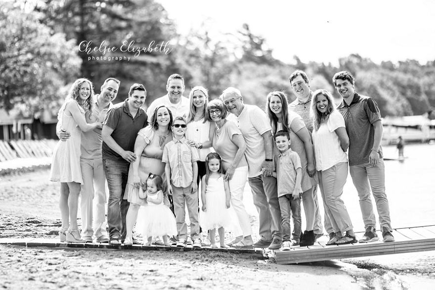 black and white family photo on beach