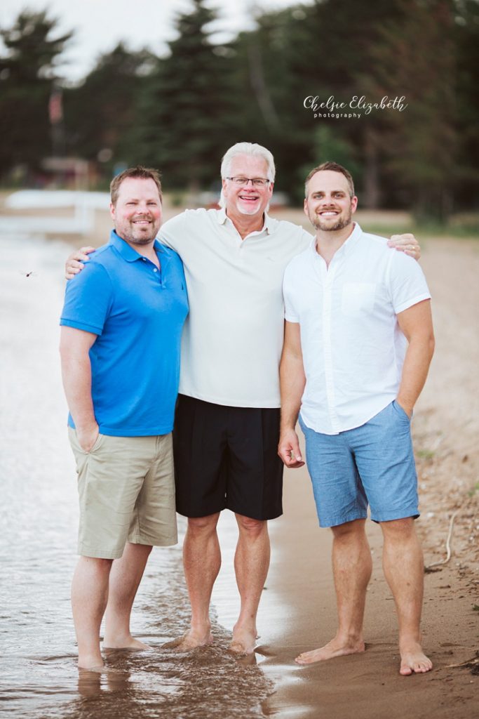 father and sons portrait on beach