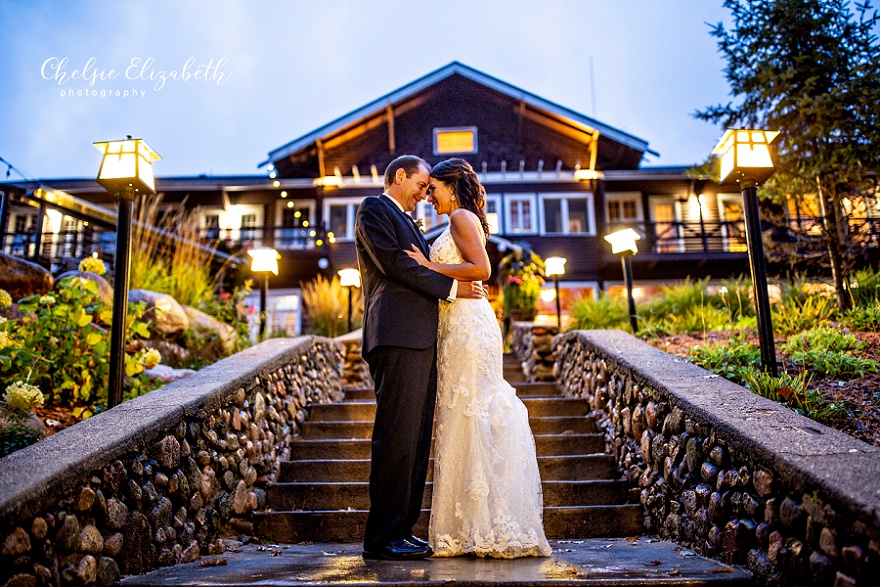 night photo of bride and groom on grand Stair case