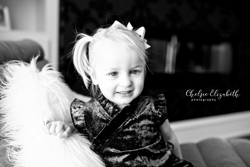 black and white portrait of two year old girl inside