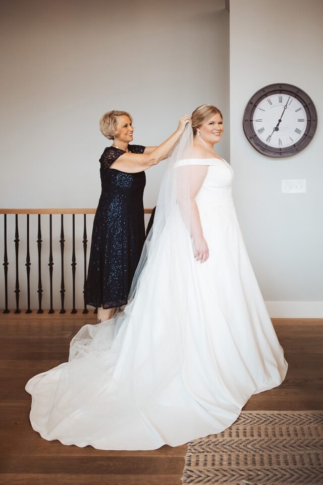 Mothe of Bride putting on bridal veil