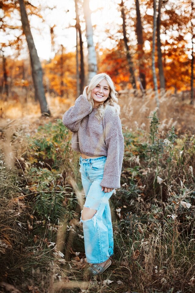 Pequot Lakes High School Senior portrait in the woods with fall colors