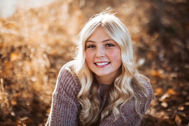 beautiful pequot lakes senior portrait in the fall at Grand View Lodge