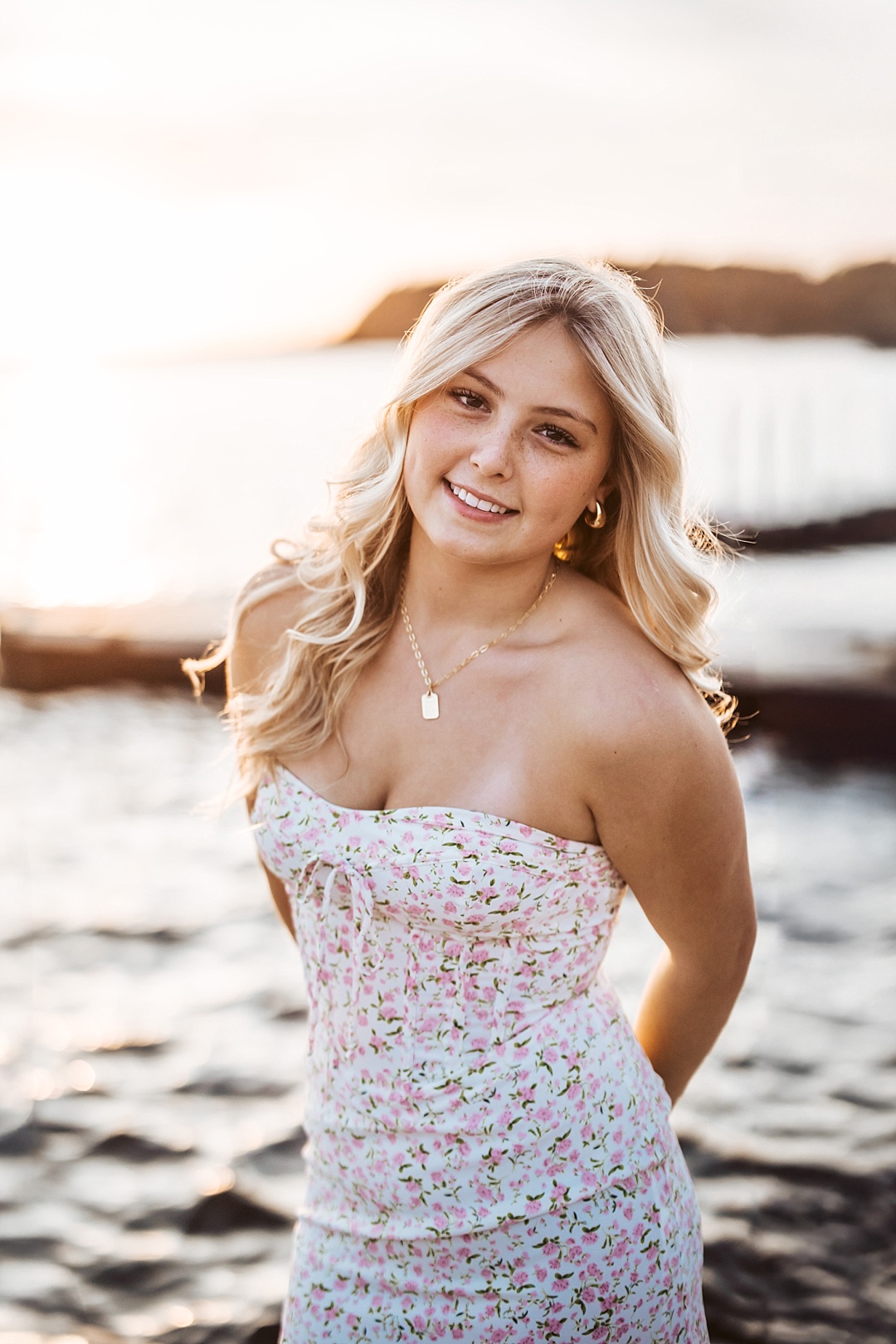 Sunset senior portrait at Grand View Lodge. High School Senior is wearing a pink sundress