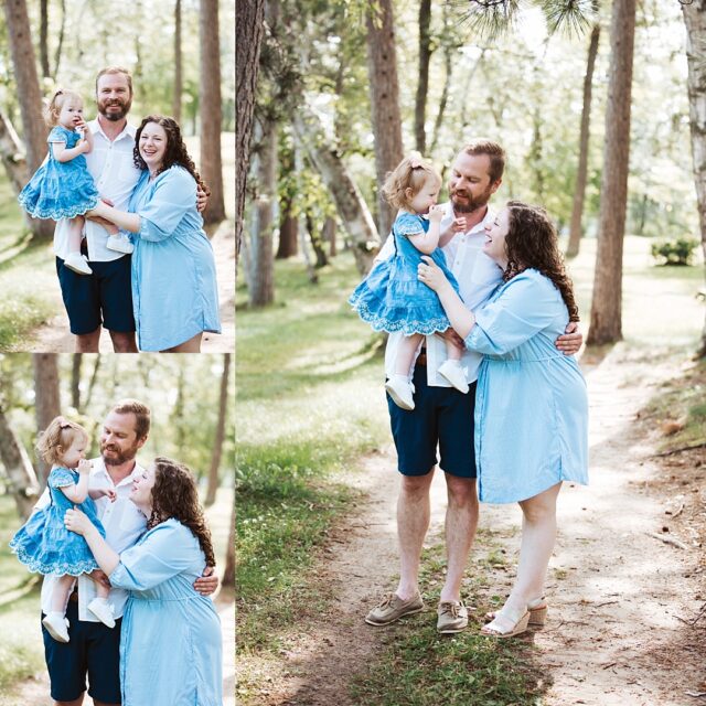 family of 3 wearing blue summer clothes for a photo session at boyd lodge in Crosslake MN