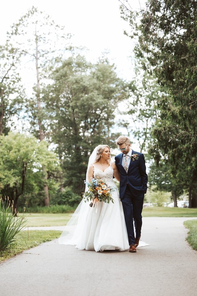 walking photo of a bride and groom at grand view lodge