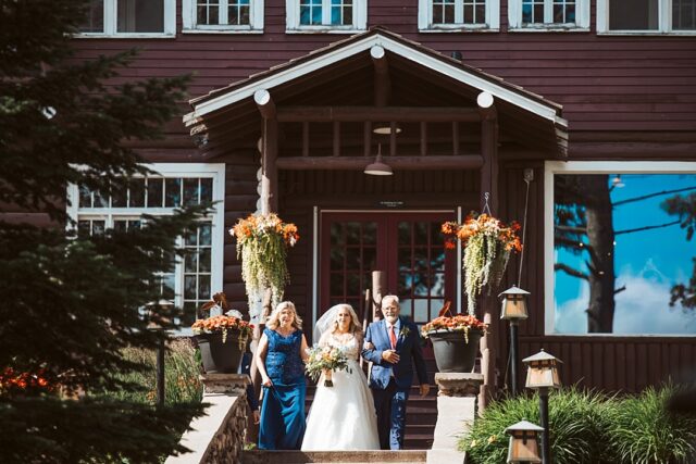 a bride about the descend the stone stairs at grand view lodge in Nisswa MN