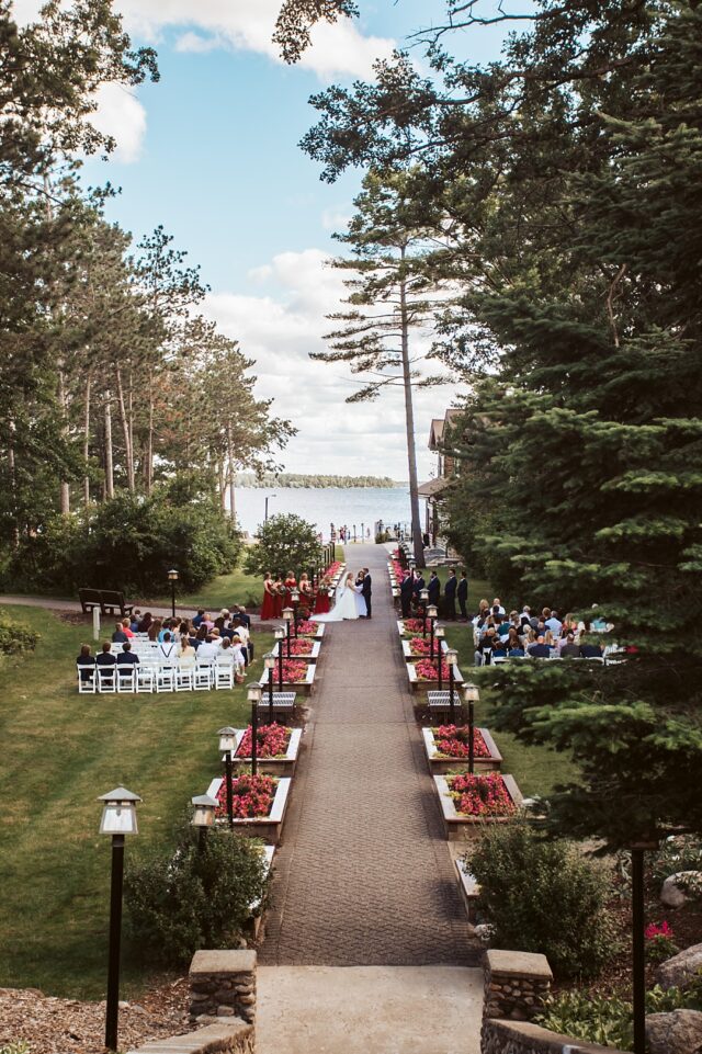 an aeiral photo of an outdoor wedding ceremony at the Stairs at Grand View Lodge on Gull Lake