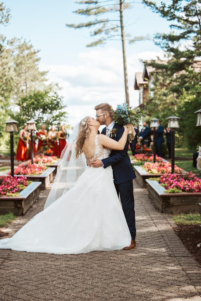 a bride and groom sharing a kiss after their wedding ceremony